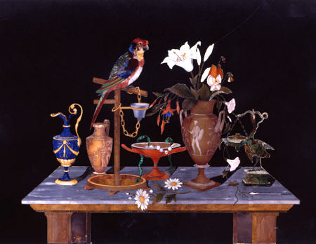A Florentine Pietra Dura Plaque With A Parrot On Its Perch On A Table  With An Etruscan Krater Vase, a 