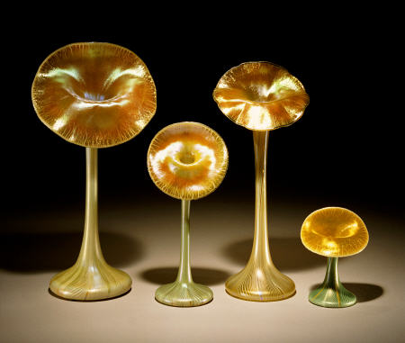 A Group Of Quezal Iridized Glass `Lily'' Vases a 