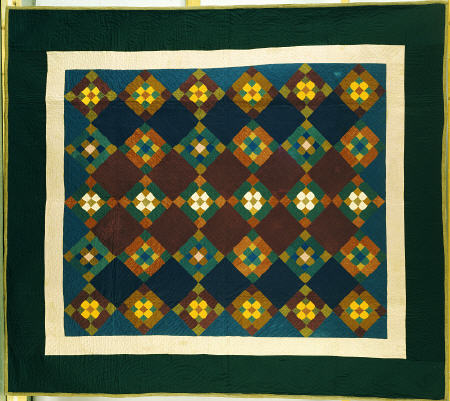An Amish Pieced & Quilted Cotton Coverlet Worked In A Variation On The Nine Patch Pattern, a 
