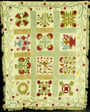 An Appliqued And Stuffed Cotton Quilted Coverlet a 