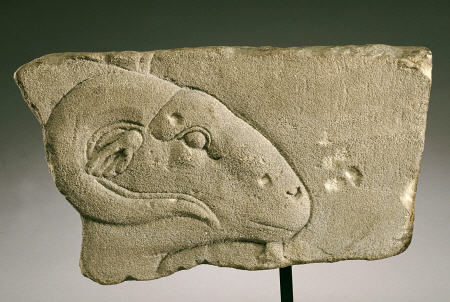 An Egyptian Gray Sandstone Relief Of A Rams Head a 