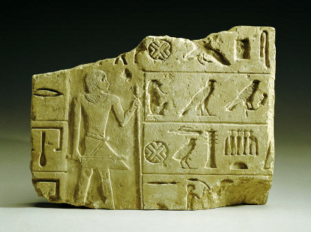 An Egyptian Limestone Relief Fragment a 