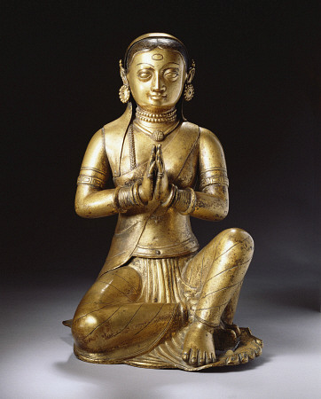 A Nepalese Embossed Gilt-Copper Figure Of A Worshipping Queen, Early 18th Century a 