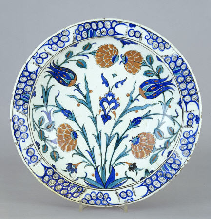 An Iznik Pottery Dish With Tulip And Peony Design, C a 