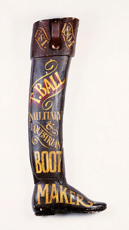 A Painted And Carved Wooden Boot Maker''s Shop Sign, 19th Century a 