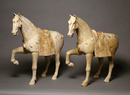 A Pair Of Buff Pottery Figures Of Prancing Caparisoned Horses a 