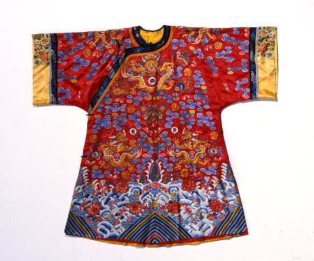 A Semi Formal Robe Of Red Satin Embroidered In Silks And Gilt Thread With Dragons Amidst Scrolling C a 