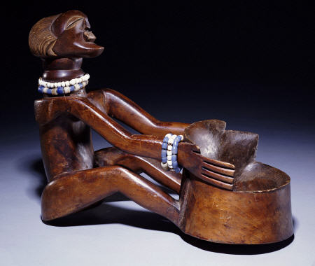 A Songye Female Bowl Bearer Carving a 