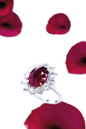 A Superb Ruby And Diamond Ring With An Oval-Shaped Ruby Weighing 8 a 