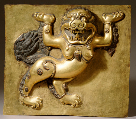 A Tibetan Gilt-Copper Panel Cast In Deep Relief With A Lion, Standing On Both Hind Legs, 18th Centur a 