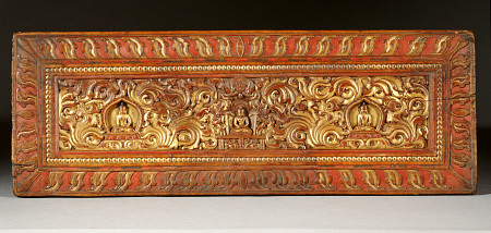 A Tibetan Gilt Wooden Manuscript Cover, circa 15th century a 