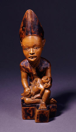 A Yombe Wood Carving Possibly Depicting A King Or Chief Presenting His Son a 