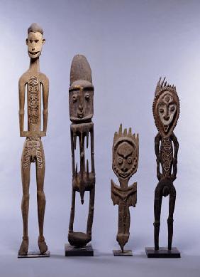 A Group Of Melanesian Figures Including An Asmat And Southern Abelam Male Figures And Karawari Cave