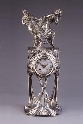 An Art Nouveau Silver-Patinated Bronze Clock Cast From Models By Maurice Dufrene (1876-1955) And Vou