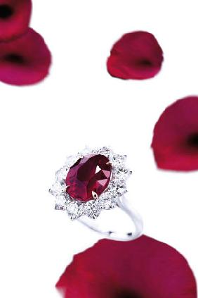 A Superb Ruby And Diamond Ring With An Oval-Shaped Ruby Weighing 8