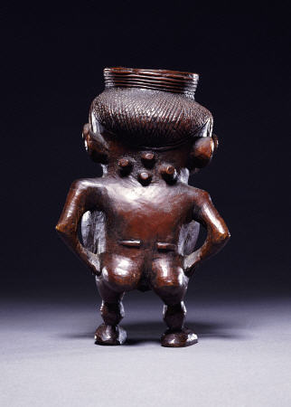 Backview Of A Wongo Cup Carved As A Female Standing Figure With Spherical Body a 