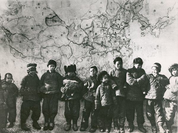 Chinese children in front of a mural, 1933 (b/w photo)  a 