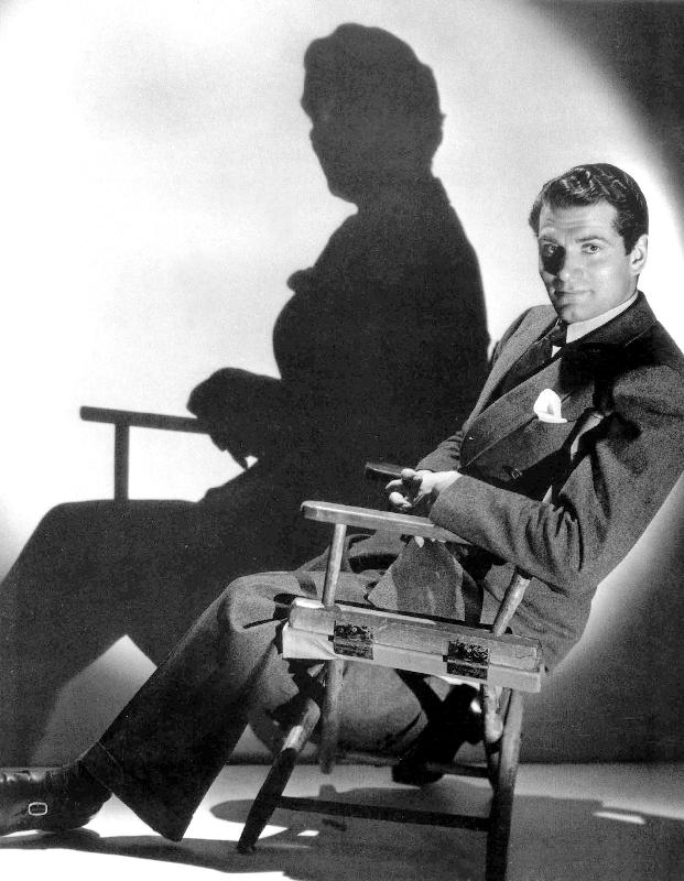 English Actor Laurence Olivier seated on a chair's director a 