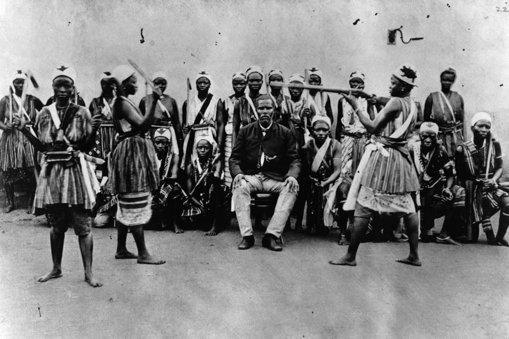 Female warriors from Dahomey, Benin,practising with weapons in front of Chacha, head and viceroy of  a 