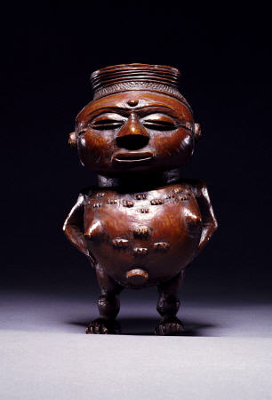 Face On View Of A Wongo Cup Carved As A Female Standing Figure With Spherical Body a 