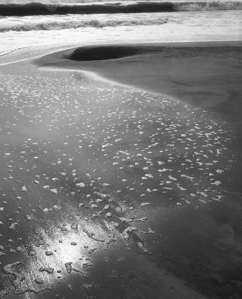 Foam on sand, Porbandar (b/w photo)  a 
