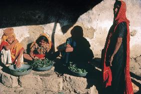 Sellers in vegetable market with typical dresses, Chorwad (photo) 