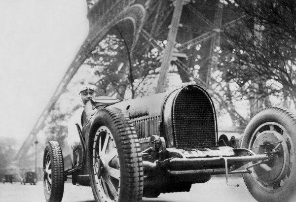 The French writer Paul Morand at the foot of the Eiffel Tower a 