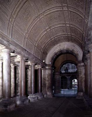The atrium, with red granite columns and a coffered barrel vaulted ceiling, designed by Antonio da S a 