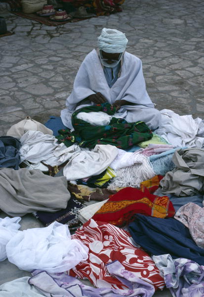 Vendor on the market place (photo)  a 