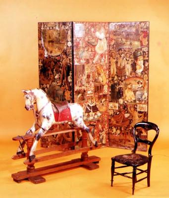 Victorian Nursery furnishings. Late 19th century rocking horse, mid-19th century scrapwork screen an a 