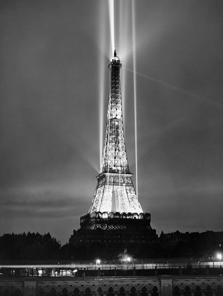 World fair in Paris: illumination of the Eiffel Tower by night a 