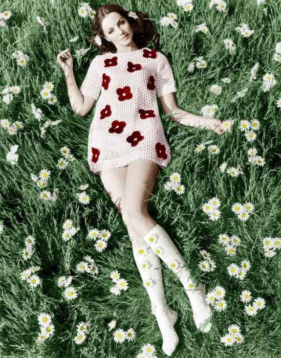 Young model Biddy Lampard in the grass wearing a short dress inspired by Courreges colourized docume a 