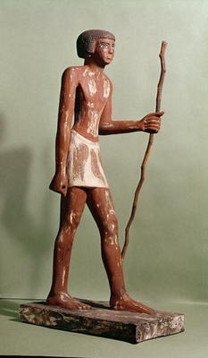 Model of an official (painted wood) a Old Kingdom Egyptian