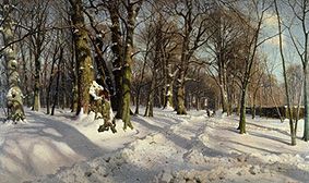 Snow-covered winter woods in the sunlight. a Peder Moensted