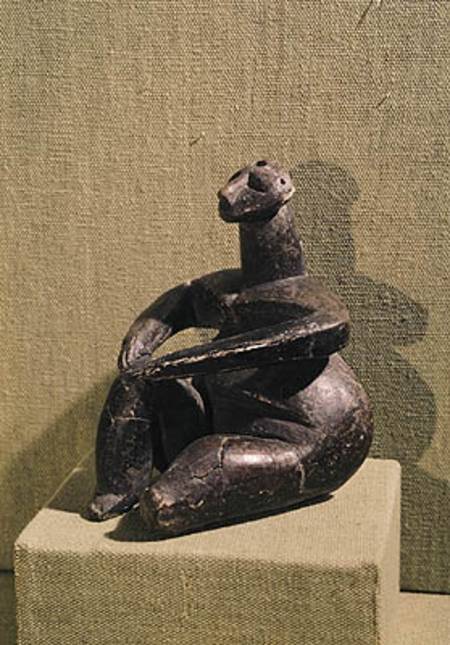 Seated female figure a Prehistoric