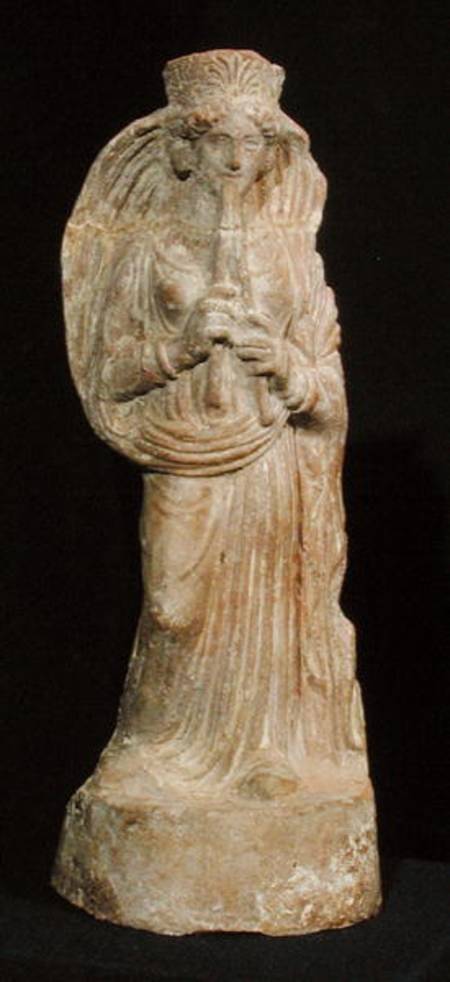 Statuette of a woman playing a double flute, from Tunisia a Punic