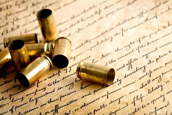 bullet casings on bill of rights a Sascha Burkard