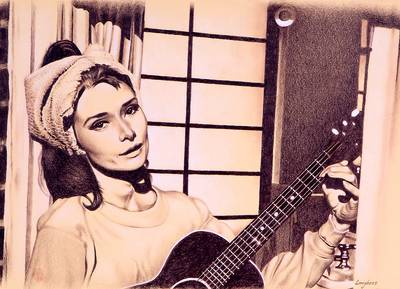 Audrey Hepburn suona la chitarra