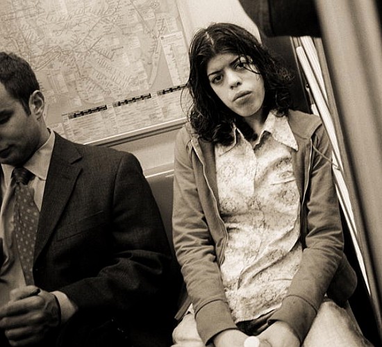 Woman sitting on a subway and staring, 2004 (b/w photo)  a Stephen  Spiller