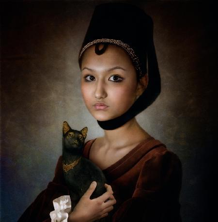 Portrait of a girl with black cat