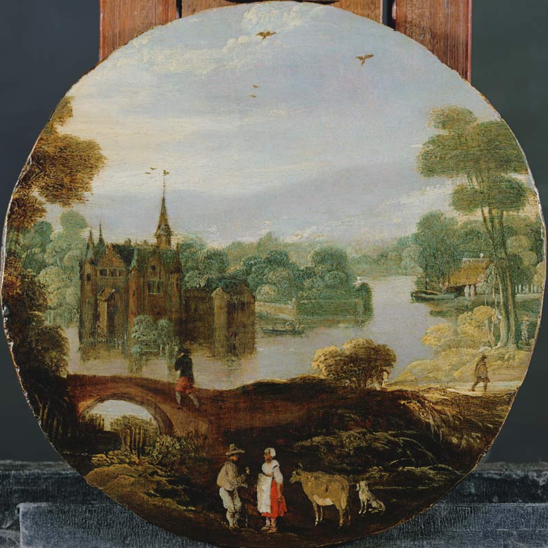 A wooded river landscape with a castle and travellers conversing a Tobias Verhaecht