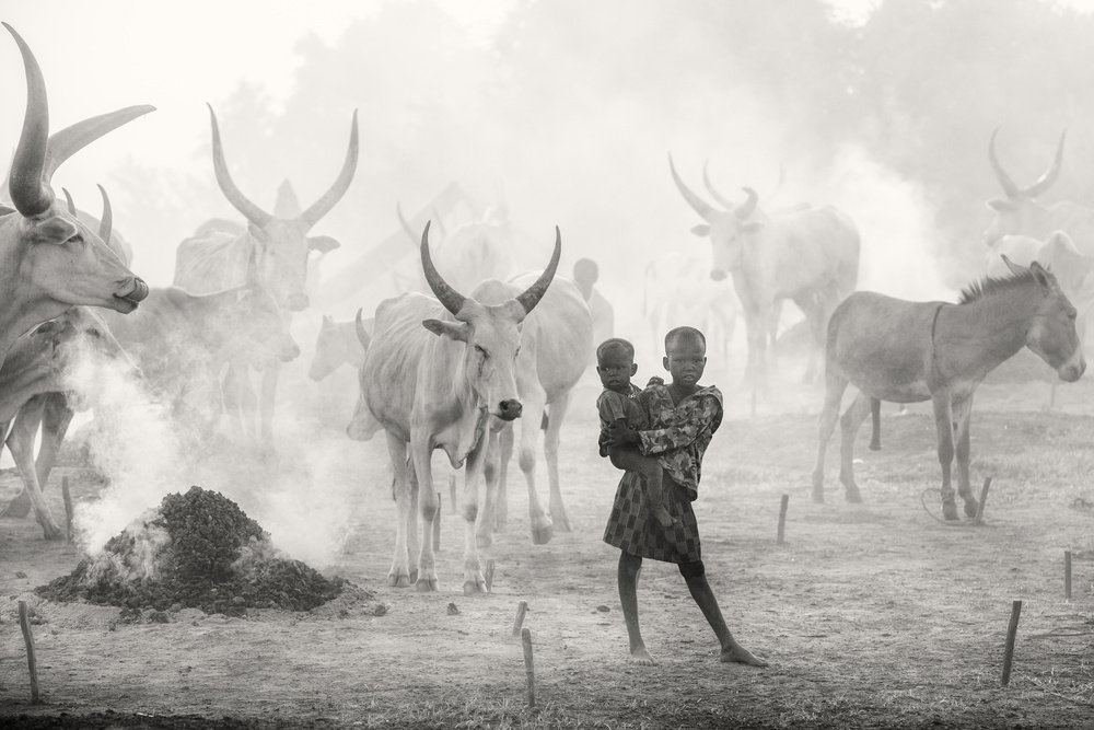 Dinka siblings in cattle camp a Trevor Cole