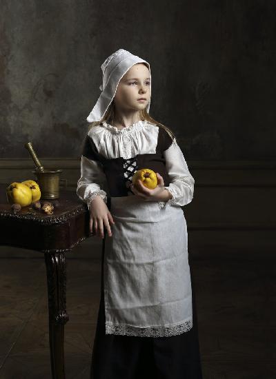 A young girl with some quinces