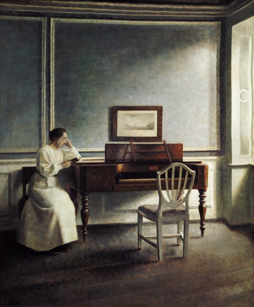 Woman, reading next to a piano in a book. a Vilhelm Hammershoi