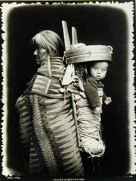 Navaho woman carrying a papoose on her back, c.1914 (b/w photo)  a William J. Carpenter