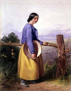 A country girl standing by a fence