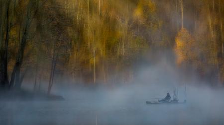 Fishing in Misty Morning